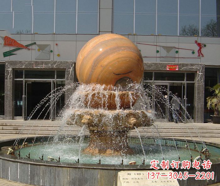 聊城石来运转球晚霞红风水球石雕