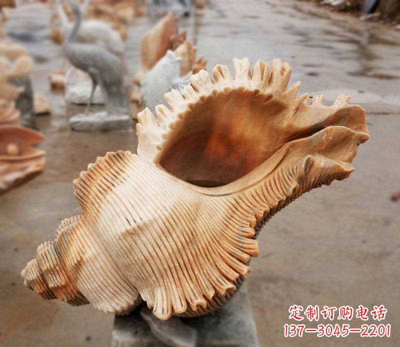 聊城晚霞红海螺石雕广场景观雕塑