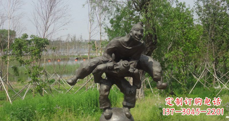 聊城园林站在球上面跳山羊的人物景观铜雕